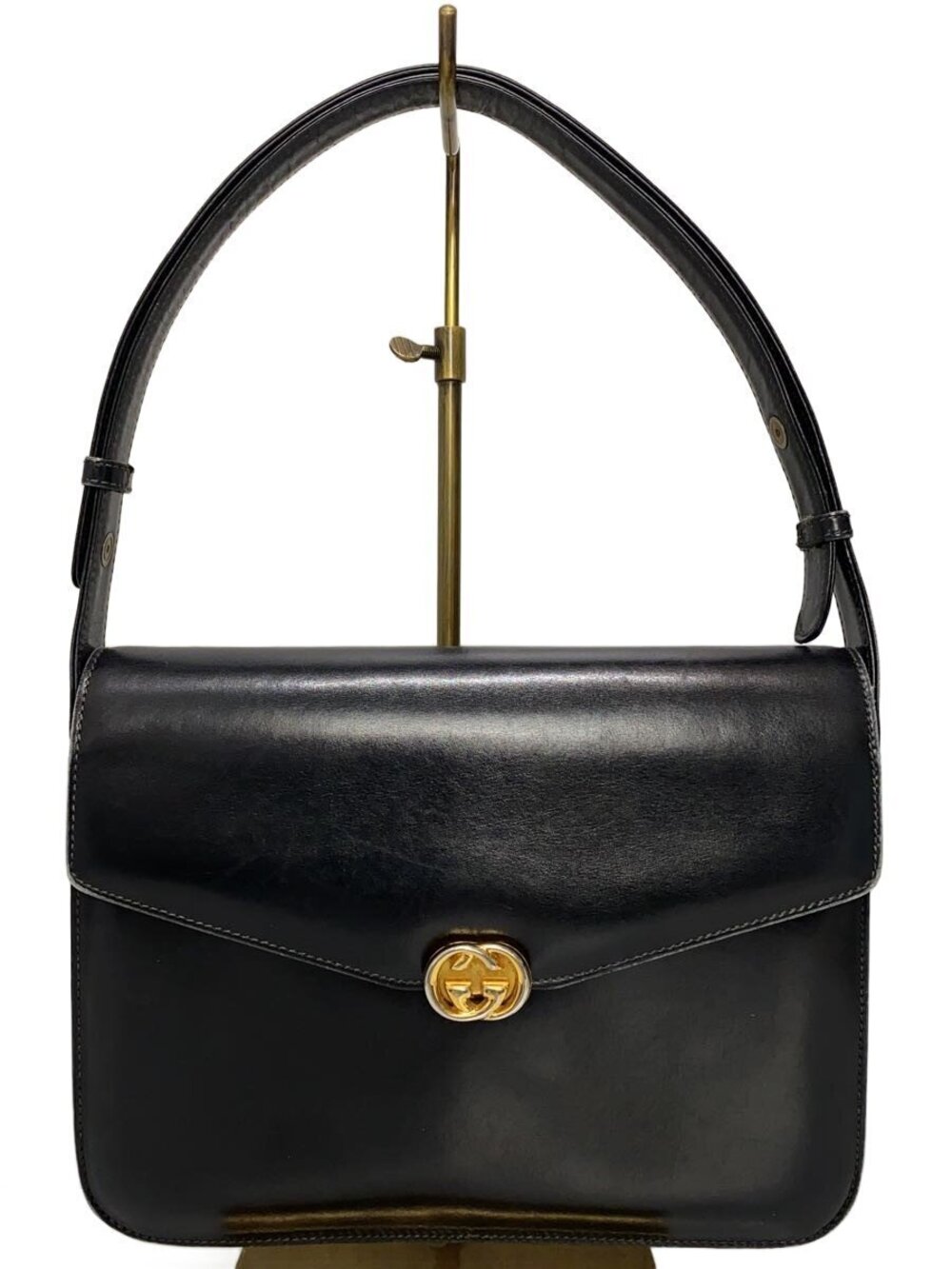 Gucci black leather shoulder bag silhouette top handle Interlocking G logo